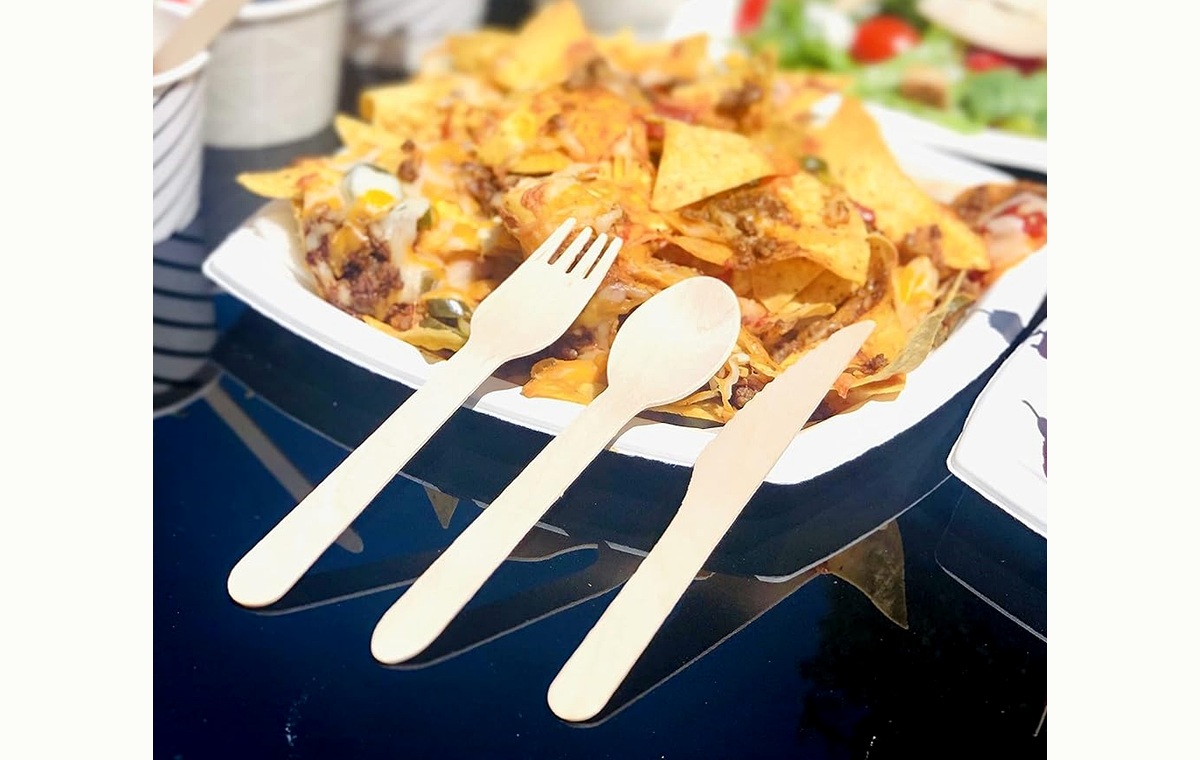 Disposable wooden knife fork and spoon in foodservice use